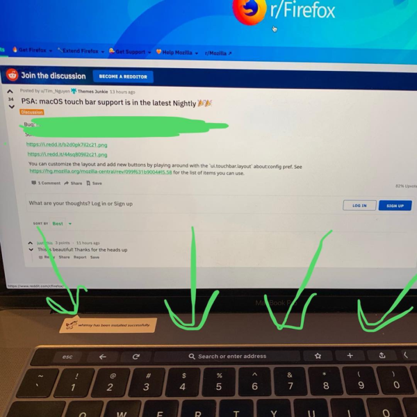 Photo of Firefox running on a MacBook Pro with a search field and shortcuts in the Touch Bar