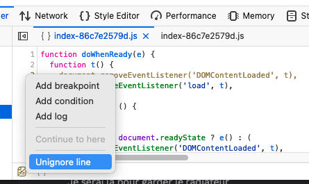 The Debugger in the Firefox Devtools is shown with a context menu opened over a particular line in some JavaScript source code. The bottom entry in the menu is highlighted, and reads "Unignore line".