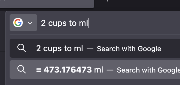 A conversion of two cups into approximately four hundred and seventy three millilitres.