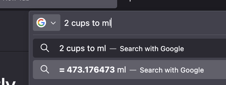 A conversion of two cups into approximately four hundred and seventy three millilitres.