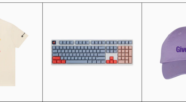 Mozilla Store product grid showing three items: a cream-colored T-shirt featuring a colorful Kit graphic, a compact mechanical keyboard with blue, red, and peach keys, and a purple baseball cap embroidered with the words “Give a fox.”