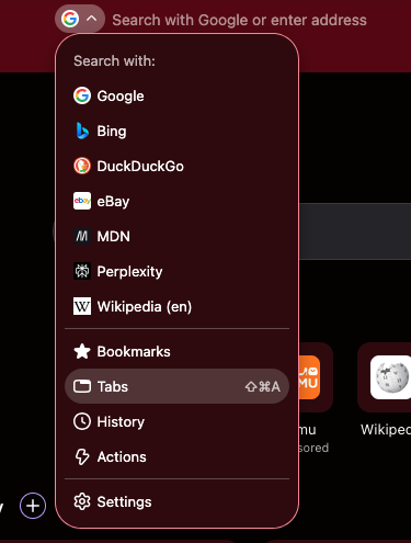 The "Search tabs" shortcut displayed in the search mode switcher menu among others, like Bookmarks and History.